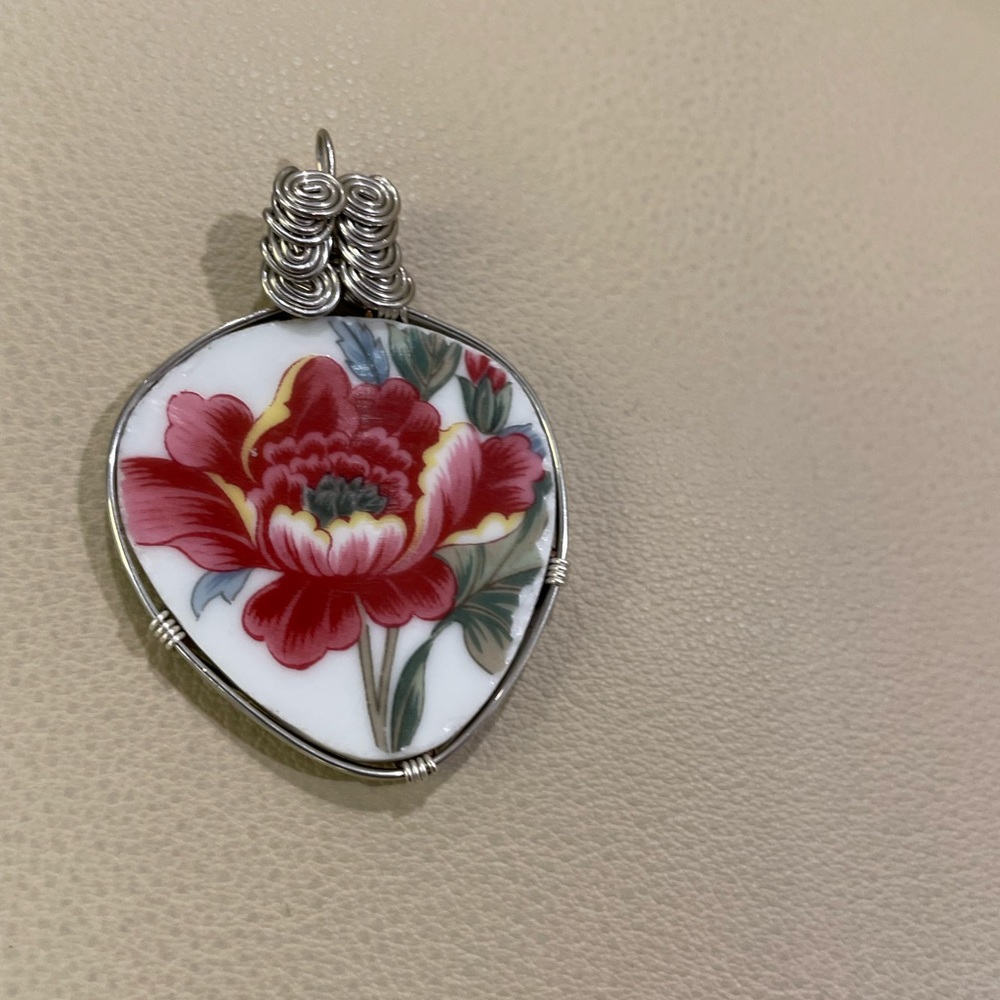 China plate  hand made wire wrapped jewelry. Cut for design and made in USA
